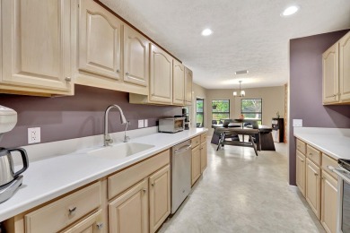 Charming pool home in Papaya Village on a rare 3/4 acre homesite on Eagle Wood Golf Course in Florida - for sale on GolfHomes.com, golf home, golf lot