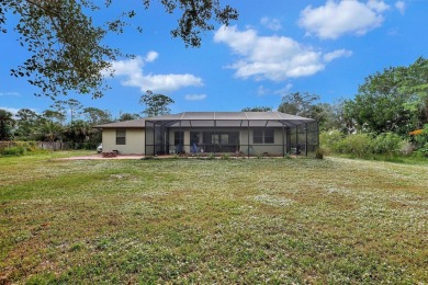Charming pool home in Papaya Village on a rare 3/4 acre homesite on Eagle Wood Golf Course in Florida - for sale on GolfHomes.com, golf home, golf lot