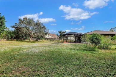Charming pool home in Papaya Village on a rare 3/4 acre homesite on Eagle Wood Golf Course in Florida - for sale on GolfHomes.com, golf home, golf lot