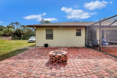 Charming pool home in Papaya Village on a rare 3/4 acre homesite on Eagle Wood Golf Course in Florida - for sale on GolfHomes.com, golf home, golf lot