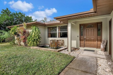 Charming pool home in Papaya Village on a rare 3/4 acre homesite on Eagle Wood Golf Course in Florida - for sale on GolfHomes.com, golf home, golf lot