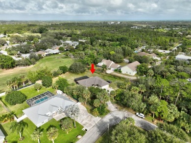 Charming pool home in Papaya Village on a rare 3/4 acre homesite on Eagle Wood Golf Course in Florida - for sale on GolfHomes.com, golf home, golf lot