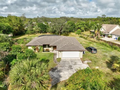 Charming pool home in Papaya Village on a rare 3/4 acre homesite on Eagle Wood Golf Course in Florida - for sale on GolfHomes.com, golf home, golf lot