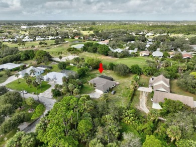 Charming pool home in Papaya Village on a rare 3/4 acre homesite on Eagle Wood Golf Course in Florida - for sale on GolfHomes.com, golf home, golf lot