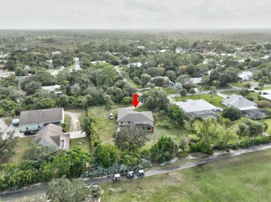 Charming pool home in Papaya Village on a rare 3/4 acre homesite on Eagle Wood Golf Course in Florida - for sale on GolfHomes.com, golf home, golf lot