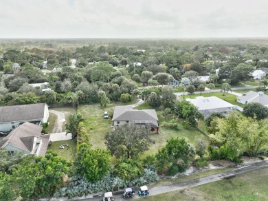 Charming pool home in Papaya Village on a rare 3/4 acre homesite on Eagle Wood Golf Course in Florida - for sale on GolfHomes.com, golf home, golf lot