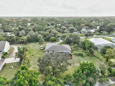 Charming pool home in Papaya Village on a rare 3/4 acre homesite on Eagle Wood Golf Course in Florida - for sale on GolfHomes.com, golf home, golf lot