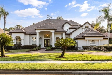 Life unfolds beautifully in this golf front estate in the on The Legacy Club At Alaqua Lakes in Florida - for sale on GolfHomes.com, golf home, golf lot