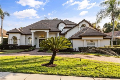 Life unfolds beautifully in this golf front estate in the on The Legacy Club At Alaqua Lakes in Florida - for sale on GolfHomes.com, golf home, golf lot