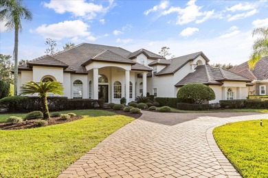 Life unfolds beautifully in this golf front estate in the on The Legacy Club At Alaqua Lakes in Florida - for sale on GolfHomes.com, golf home, golf lot