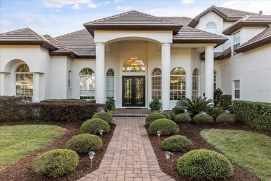 Life unfolds beautifully in this golf front estate in the on The Legacy Club At Alaqua Lakes in Florida - for sale on GolfHomes.com, golf home, golf lot