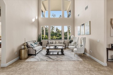 Life unfolds beautifully in this golf front estate in the on The Legacy Club At Alaqua Lakes in Florida - for sale on GolfHomes.com, golf home, golf lot