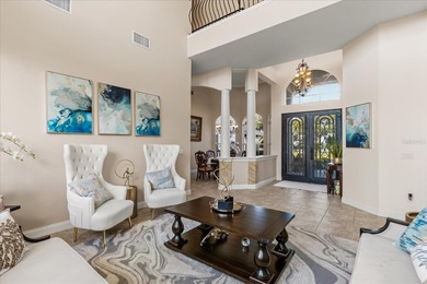 Life unfolds beautifully in this golf front estate in the on The Legacy Club At Alaqua Lakes in Florida - for sale on GolfHomes.com, golf home, golf lot