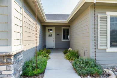A meticulous home offering a seamless open-concept design with on Hunters Point Golf Club in Idaho - for sale on GolfHomes.com, golf home, golf lot