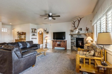 A meticulous home offering a seamless open-concept design with on Hunters Point Golf Club in Idaho - for sale on GolfHomes.com, golf home, golf lot