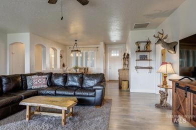 A meticulous home offering a seamless open-concept design with on Hunters Point Golf Club in Idaho - for sale on GolfHomes.com, golf home, golf lot