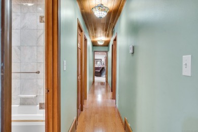Set on a generous half-acre corner lot, this 3,400 sq ft home on Ailing Memorial Golf Course in Connecticut - for sale on GolfHomes.com, golf home, golf lot