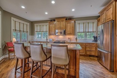 Experience luxury living in this 3-bedroom, 3-bath condominium on Old Edwards Club in North Carolina - for sale on GolfHomes.com, golf home, golf lot