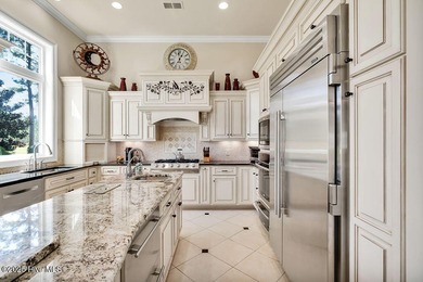 Discover refined luxury and timeless craftsmanship in this on Ocean Ridge Plantation in North Carolina - for sale on GolfHomes.com, golf home, golf lot