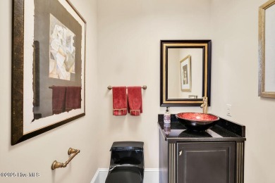 Discover refined luxury and timeless craftsmanship in this on Ocean Ridge Plantation in North Carolina - for sale on GolfHomes.com, golf home, golf lot