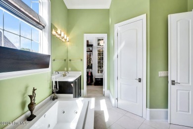 Discover refined luxury and timeless craftsmanship in this on Ocean Ridge Plantation in North Carolina - for sale on GolfHomes.com, golf home, golf lot