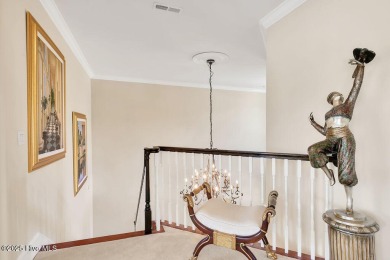 Discover refined luxury and timeless craftsmanship in this on Ocean Ridge Plantation in North Carolina - for sale on GolfHomes.com, golf home, golf lot