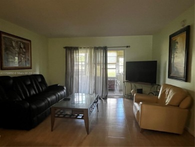 Spacious and beautiful 2-bedroom, 2-bathroom first-floor unit on Oriole Golf and Tennis Club in Florida - for sale on GolfHomes.com, golf home, golf lot
