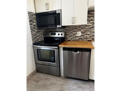 Spacious and beautiful 2-bedroom, 2-bathroom first-floor unit on Oriole Golf and Tennis Club in Florida - for sale on GolfHomes.com, golf home, golf lot