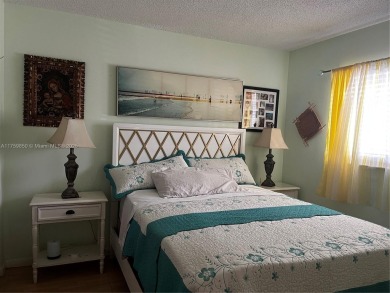 Spacious and beautiful 2-bedroom, 2-bathroom first-floor unit on Oriole Golf and Tennis Club in Florida - for sale on GolfHomes.com, golf home, golf lot