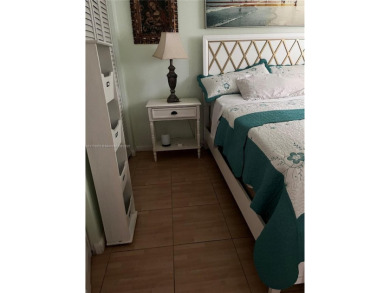 Spacious and beautiful 2-bedroom, 2-bathroom first-floor unit on Oriole Golf and Tennis Club in Florida - for sale on GolfHomes.com, golf home, golf lot