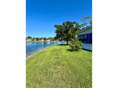 This beautiful two-bedroom, two-bath home is located in the on Pine Lakes Country Club in Florida - for sale on GolfHomes.com, golf home, golf lot