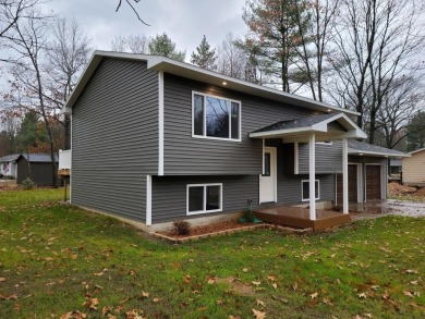 Spacious bi-level that has been fully renovated inside and out on Twin Birch Golf Club in Michigan - for sale on GolfHomes.com, golf home, golf lot