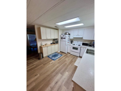 This beautiful two-bedroom, two-bath home is located in the on Pine Lakes Country Club in Florida - for sale on GolfHomes.com, golf home, golf lot
