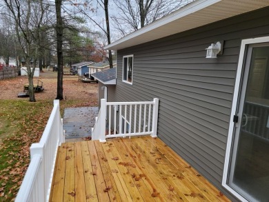 Spacious bi-level that has been fully renovated inside and out on Twin Birch Golf Club in Michigan - for sale on GolfHomes.com, golf home, golf lot