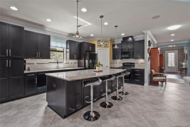 Experience resort-style living every day in this beautifully on Esplanade Golf and Country at Lakewood Ranch in Florida - for sale on GolfHomes.com, golf home, golf lot