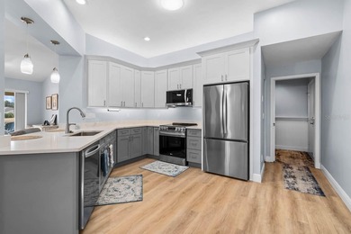 Gorgeous, meticulously renovated 2-bed, 2-bath, 2-car POND VIEW on Scepter Golf Club in Florida - for sale on GolfHomes.com, golf home, golf lot