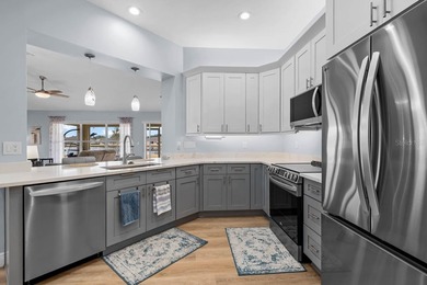 Gorgeous, meticulously renovated 2-bed, 2-bath, 2-car POND VIEW on Scepter Golf Club in Florida - for sale on GolfHomes.com, golf home, golf lot