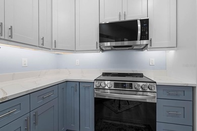 Gorgeous, meticulously renovated 2-bed, 2-bath, 2-car POND VIEW on Scepter Golf Club in Florida - for sale on GolfHomes.com, golf home, golf lot