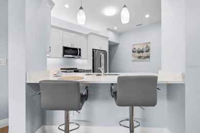 Gorgeous, meticulously renovated 2-bed, 2-bath, 2-car POND VIEW on Scepter Golf Club in Florida - for sale on GolfHomes.com, golf home, golf lot