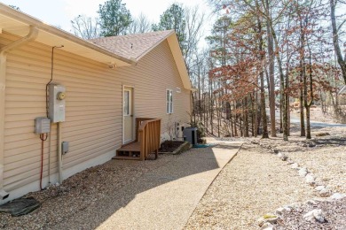 Great curb appeal with additional landscaping in this on Ponce De Leon Golf Course in Arkansas - for sale on GolfHomes.com, golf home, golf lot