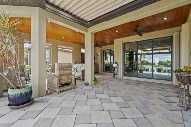 Experience resort-style living every day in this beautifully on Esplanade Golf and Country at Lakewood Ranch in Florida - for sale on GolfHomes.com, golf home, golf lot