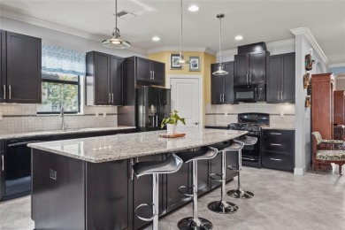 Experience resort-style living every day in this beautifully on Esplanade Golf and Country at Lakewood Ranch in Florida - for sale on GolfHomes.com, golf home, golf lot