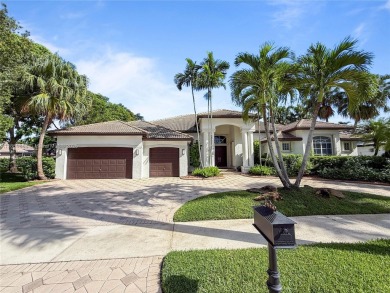 Welcome Home! This spectacular residence, boasting a lake and on Weston Hills Country Club in Florida - for sale on GolfHomes.com, golf home, golf lot