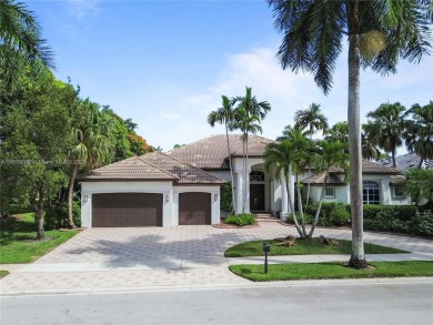 Welcome Home! This spectacular residence, boasting a lake and on Weston Hills Country Club in Florida - for sale on GolfHomes.com, golf home, golf lot