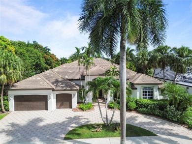 Welcome Home! This spectacular residence, boasting a lake and on Weston Hills Country Club in Florida - for sale on GolfHomes.com, golf home, golf lot