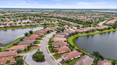 Experience resort-style living every day in this beautifully on Esplanade Golf and Country at Lakewood Ranch in Florida - for sale on GolfHomes.com, golf home, golf lot