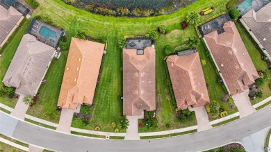 Experience resort-style living every day in this beautifully on Esplanade Golf and Country at Lakewood Ranch in Florida - for sale on GolfHomes.com, golf home, golf lot