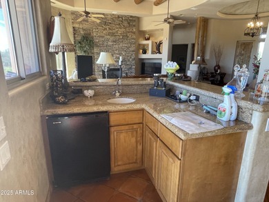 This exceptional turnkey residence is situated in Pinnacle on  in Arizona - for sale on GolfHomes.com, golf home, golf lot
