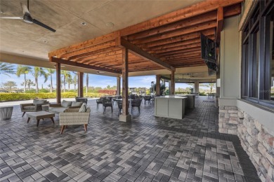 Experience resort-style living every day in this beautifully on Esplanade Golf and Country at Lakewood Ranch in Florida - for sale on GolfHomes.com, golf home, golf lot