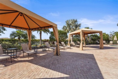 Experience resort-style living every day in this beautifully on Esplanade Golf and Country at Lakewood Ranch in Florida - for sale on GolfHomes.com, golf home, golf lot